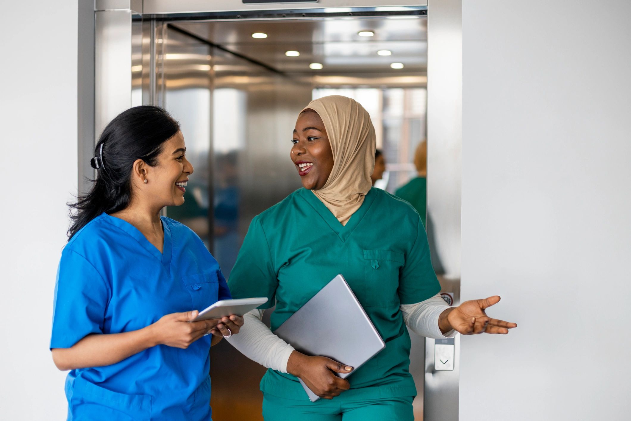 Medical professionals walking together in a hospital corridor