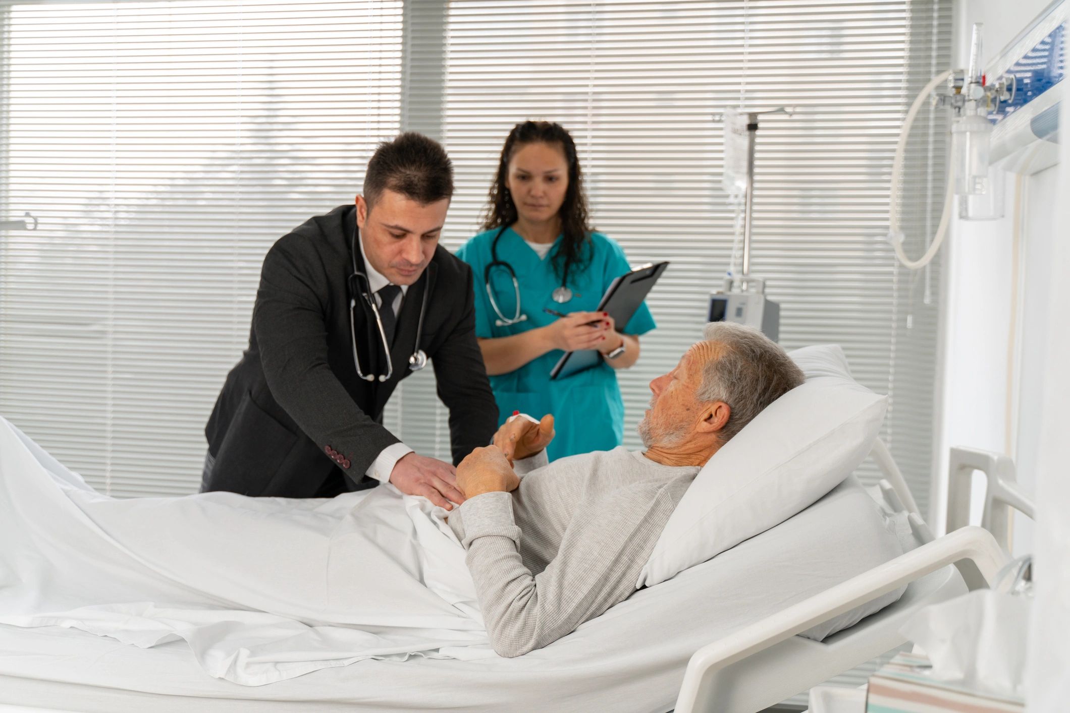 Doctor examining a patient in a hospital consultation room