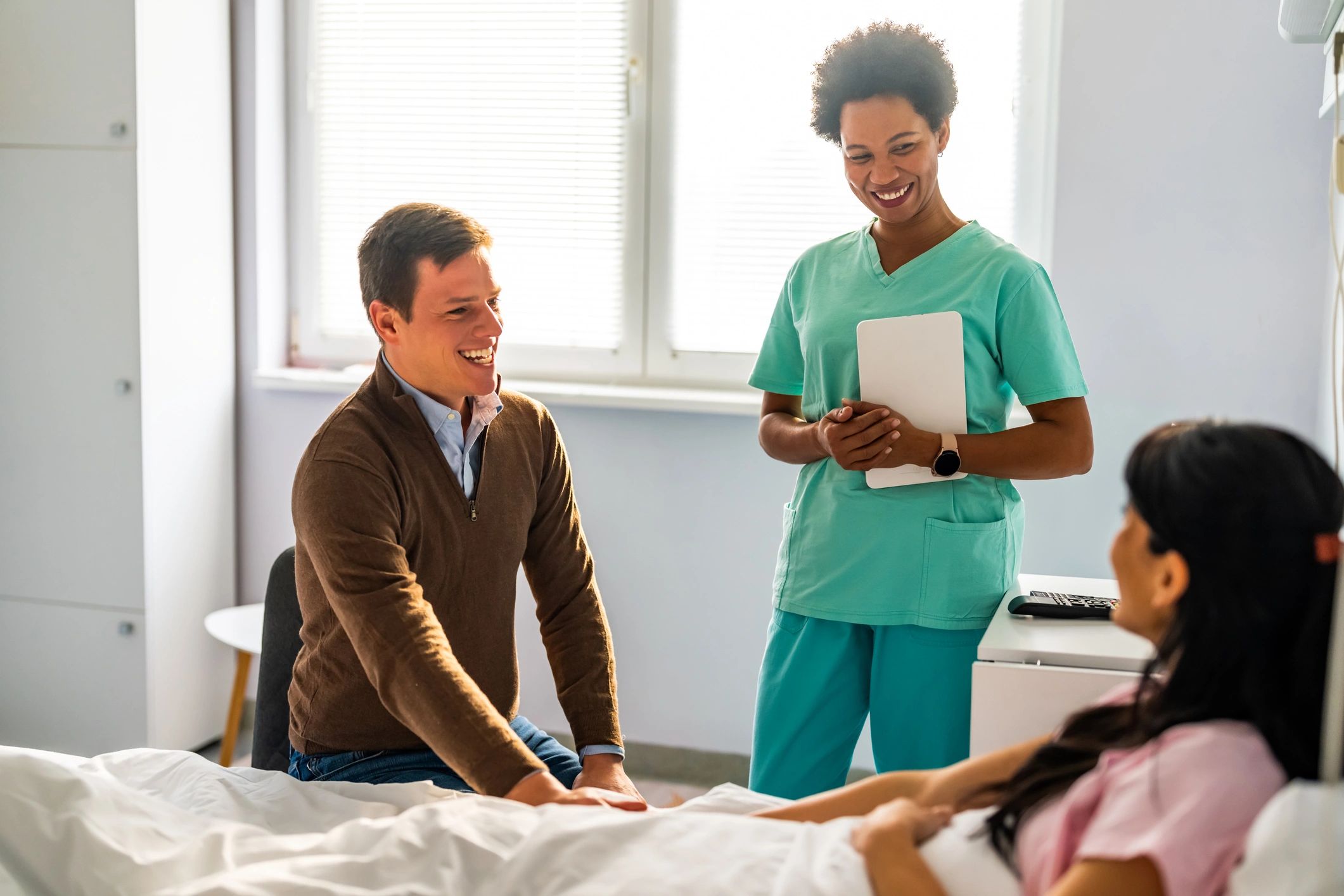 Patient and companion receiving guidance in a hospital setting