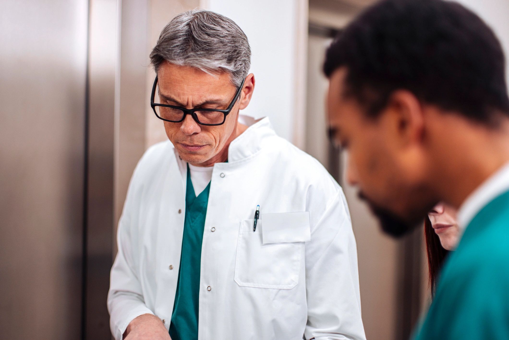 Medical team consulting in a hospital corridor